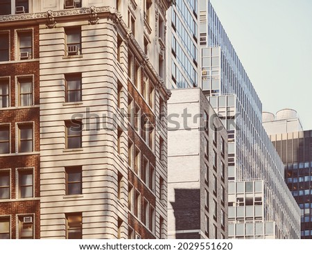 Old and modern buildings in Manhattan, color toning applied, New York City, USA.