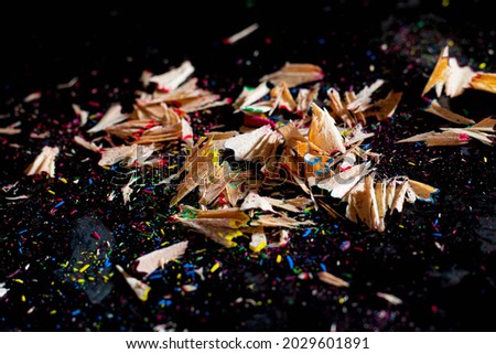 Colorful Pencil Shavings On Black Table	
