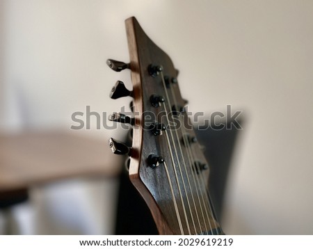 A closeup shot of an acoustic guitar