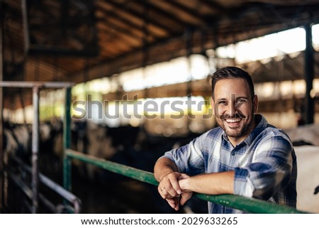 Portrait of adult man, enjoying his visit to his grandparents farm.