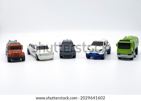 multicolored toy car model isolated on white background