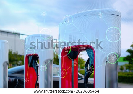 white electric charging station, the concept of the development of alternative energy, the production of electric vehicles, the ecology of cities