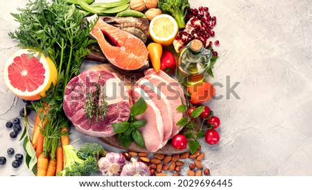 Paleo diet food on light gray background. Healthy high protein and low carbohydrate products. Top view, flat lay, copy space Royalty-Free Stock Photo #2029696445