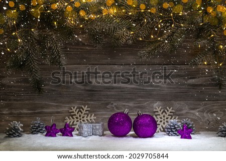 Christmas card with a garland and Christmas decorations. Copy space.
