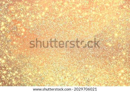 Abstract defocused dark orange background with bokeh, candy glitter and blur, festive bright background.Frame for Thanksgiving, Autumn, Halloween or Christmas party Banner for your text,