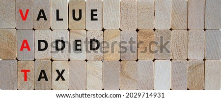 VAT, value added tax symbol. Wooden blocks with concept words 'VAT, value added tax'. Beautiful wooden background, copy space. Business and VAT, value added tax concept.