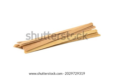 disposable wooden sticks for stirring hot drinks isolated on white background. Coffee and tea spoon, zero waste Royalty-Free Stock Photo #2029729319
