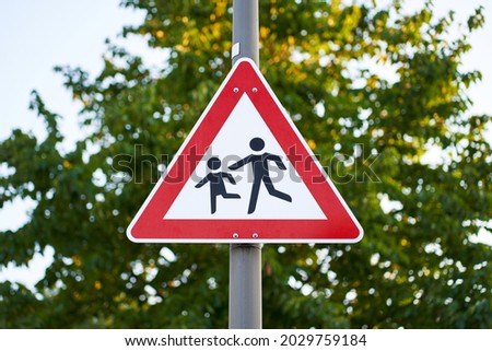 Road sign children on a lantern.