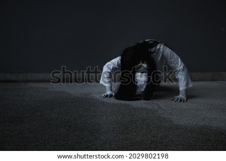 Woman ghost horror creepy her is crawling, halloween concept Royalty-Free Stock Photo #2029802198