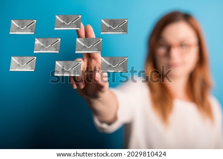 A woman showing 3D rendering of online Message and Chat icons