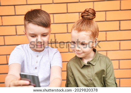 Pretty face. Cute school child taking selfie. Active vacation. Brother and sister. Online video call. Happy children concept. Lifestyle action. Wathing school lesson