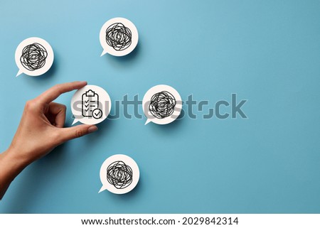 Conversational clouds with drawings of intricate lines and one with a clear plan. A symbol of choice clarity and order in affairs Royalty-Free Stock Photo #2029842314