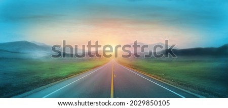 Mountain road. Landscape with green field, sunny sky with clouds and beautiful asphalt road in the morning. Scenic background. Road to mountains. Transportation, direction, business goal, hope. Royalty-Free Stock Photo #2029850105