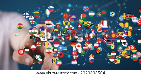 A hand selecting from an interconnected network of international flags