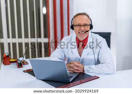 Doctor working on distance with computer. Epidemiologist doctor working on laptop. Royalty-Free Stock Photo #2029924169