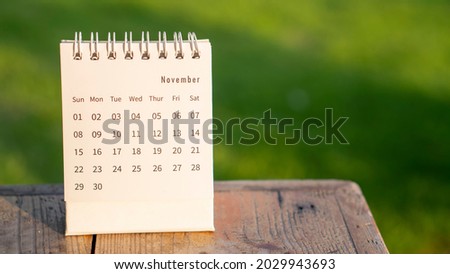 2021 Calendar desk place on table. Desktop Calender for Planner to plan agenda, timetable, appointment, organization, management each date, month, and year on wooden office table.Calendar Concept.