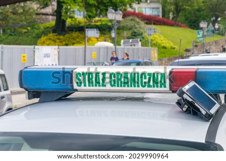 Sign Polish Border Guard (Polish Straz Graniczna, also abbreviated as SG).