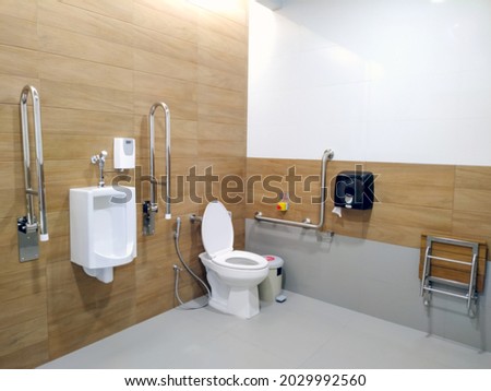 Toilet for handicap, blurred background.