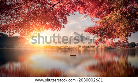 Colorful Autumn Season and Mountain Fuji with morning fog and red leaves at lake Kawaguchiko is one of the best places in Japan Royalty-Free Stock Photo #2030002661