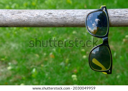 Black sunglasses for women with a yellow frame