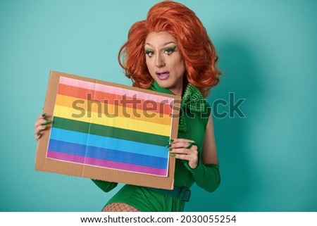 Drag queen with LGBTQ flag
