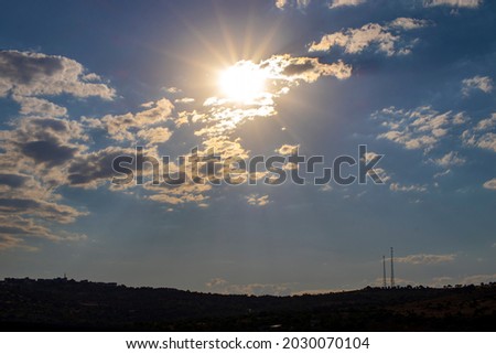 sun rays radiate. sky view. low aperture photo.