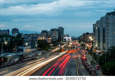 Highway in the evening time. Night city with lights. Long exposure picture