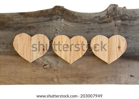 Three Love Valentines wooden hearts from recycled old palette on old grey Elm background, copy space