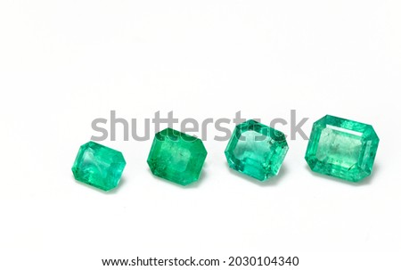 Emerald Gemstones on White Background Royalty-Free Stock Photo #2030104340