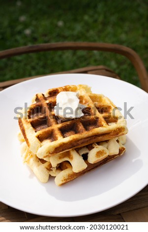 Waffles with butter on the white plate. Keto diet.