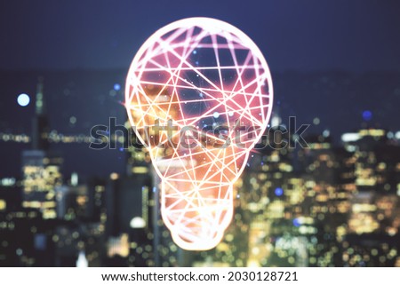 Abstract virtual light bulb hologram on blurry office buildings background, idea concept. Multiexposure