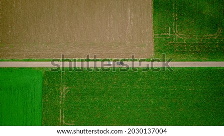 Arial picture of 4x4 vehicles in green landscape