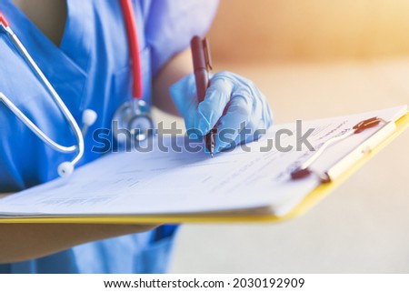 Doctor nurse followup data with medical examination document for patient health check in hospital or clinic.
