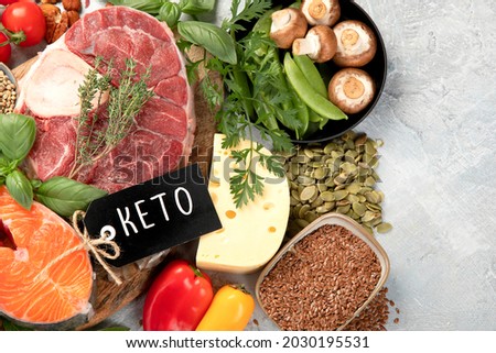 Keto diet food on light gray background. Healthy low carb, high fat diet. Top view, flat lay, copy space