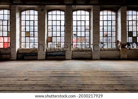 Windows of a ruined factory wall with old and broken mat glass and corroded iron in a brick wall in a lost place in Germany Royalty-Free Stock Photo #2030217929