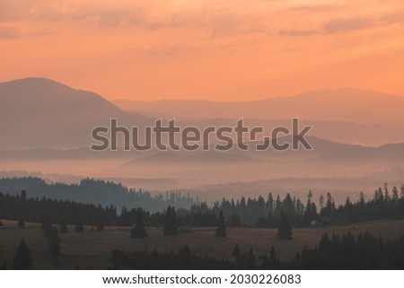 foggy landscape between mountains in the morning