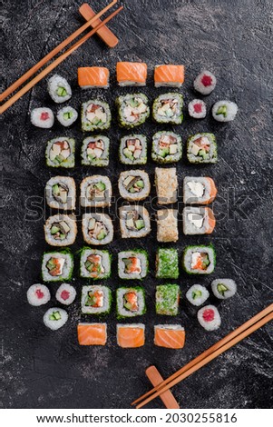 Sushi set isolated on black background. Photo for the menu and site. Top view
