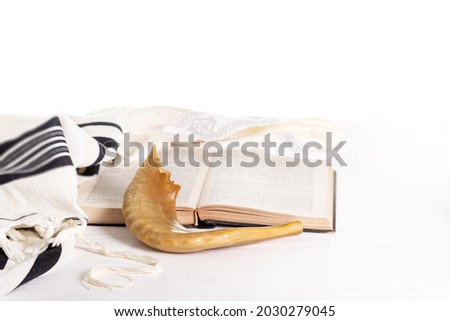 Rosh Hashanah. Yom Kippur. Tallit, shofar, torah on a white background. Isolated Royalty-Free Stock Photo #2030279045