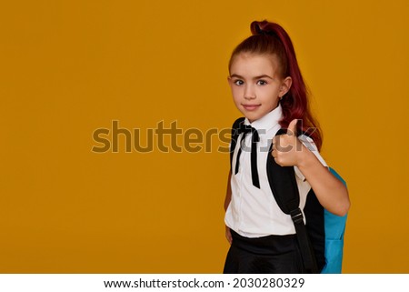 adorable schoolgirl with backpack. Back to school