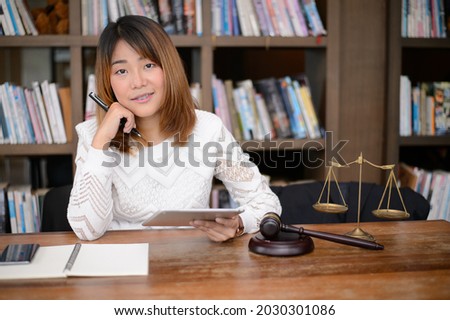 young Asian woman at office of their business online shopping,In home office,Start up small business entrepreneur SME.