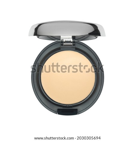 Dry face powder in round black casket isolated on white background