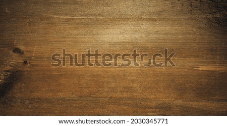 Rectangular texture of old wood with brown fibers in a retro style. The form of a banner with an empty space for the text.