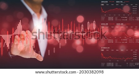 Businessman touchscreen line of Stock market or forex trading graph and candlestick chart suitable for financial investment concept,Economy trends background for business idea and all art work design.
