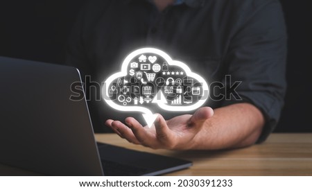 Businessman hand with cloud computing technology symbol. transformation and technology items such as upload download. cloud computing and technology concept. 