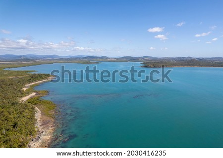 Drone aerial landscape with blue ocean and sky towards land
