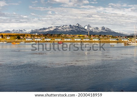 Panoramic view of the Bay of Ushuaia with snowy mountains in the background