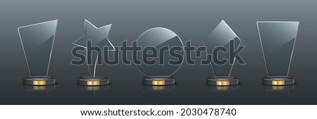 Award trophy set. Star and rectangle shaped glass prize statues on gray background. Champion glory in competition vector illustration. Hollywood fame in film or championship in sport. Royalty-Free Stock Photo #2030478740