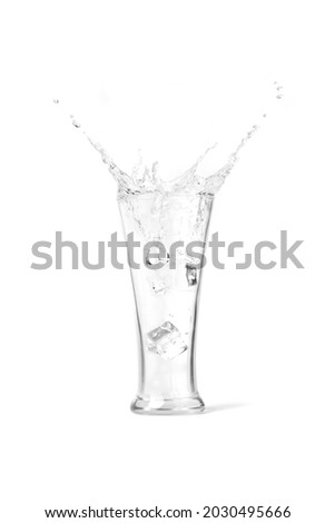 splash fresh pure water in glass with ice drop. isolate on white background with clipping path.