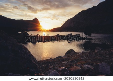 Koulikalon lakes and surrounding peaks in Fann mountains, Tajikistan during sunset