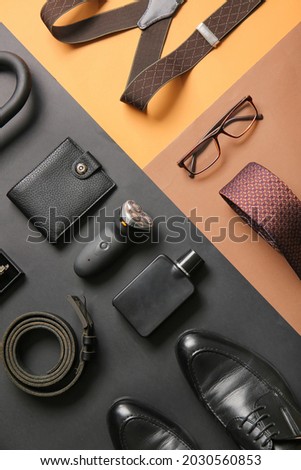 Stylish male accessories on color background Royalty-Free Stock Photo #2030560853